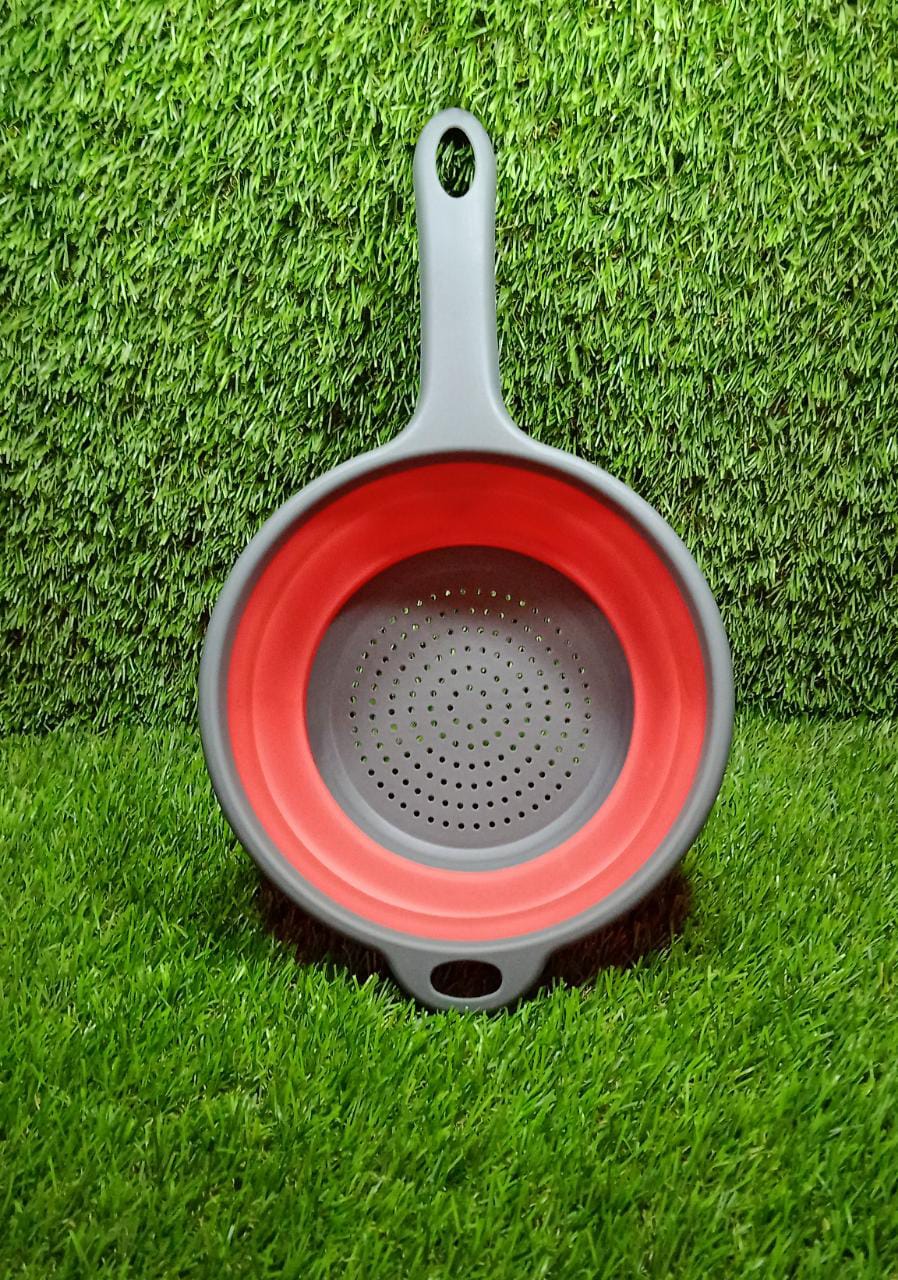 Collapsible colander folded flat on kitchen counter